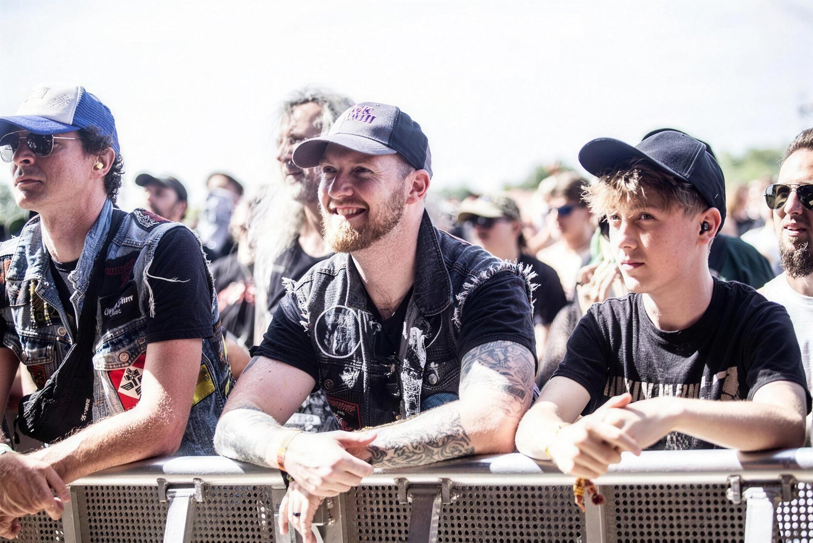 Fans in patched and studded denim battle vests at the barrier during Bloodstock Open Air festival, 2026