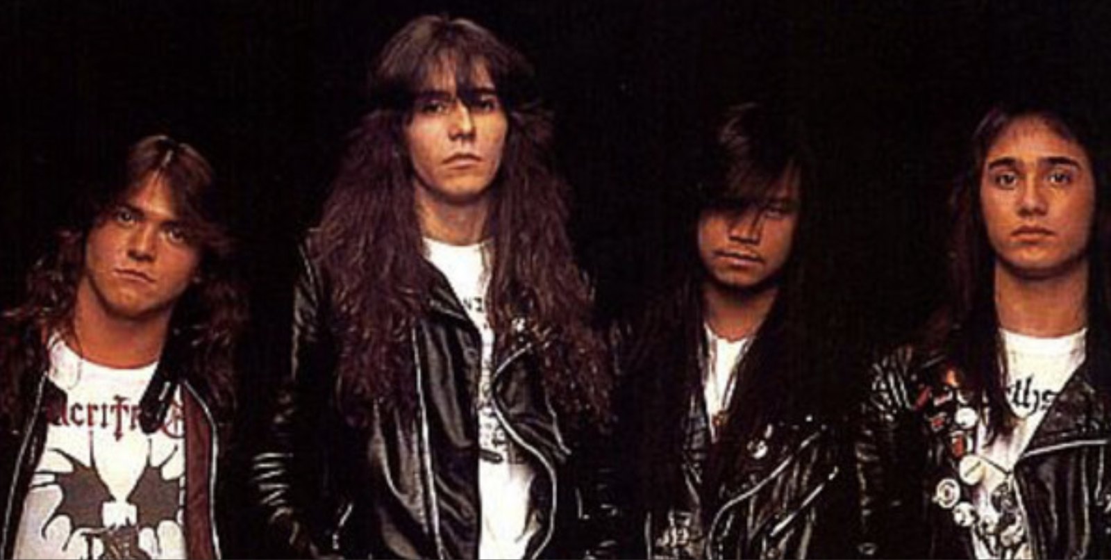 The four members of Sacrifice photographed together in leather jackets in the mid 1980s