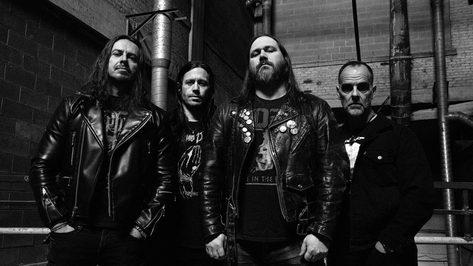 The members of Temple of Void in leather jackets in a black and white band photograph