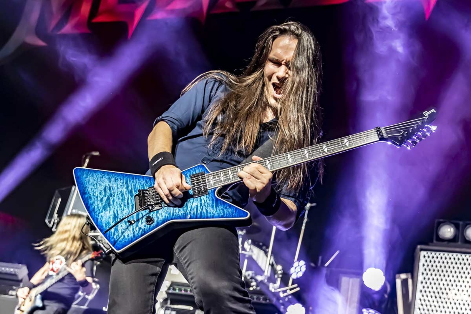 Teemu Mantysaari of Megadeth with both hands on the neck of his guitar at the O2 in London in October 2025