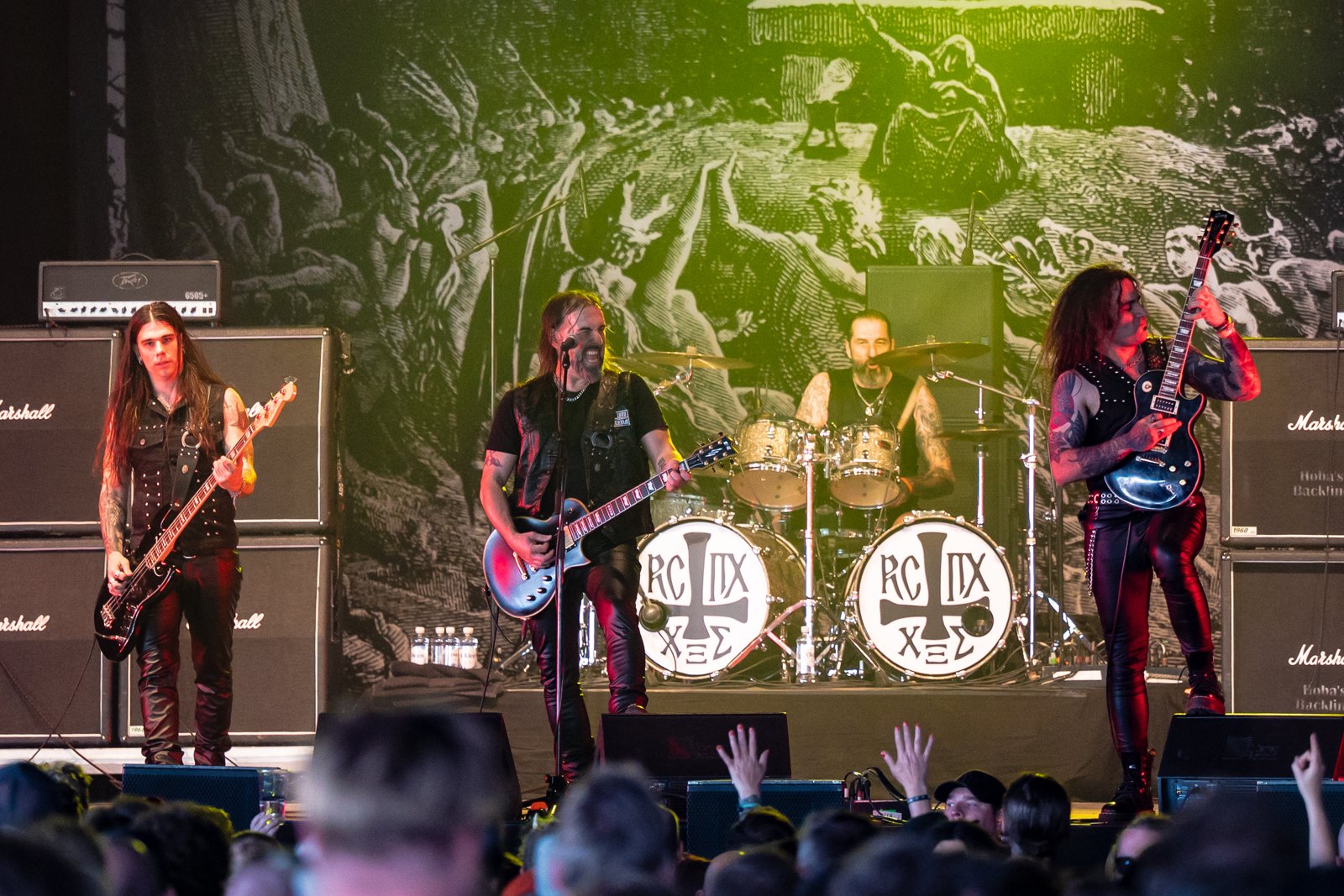 Rotting Christ on stage at the Tons of Rock festival in June 2024, the band logo on the drum heads
