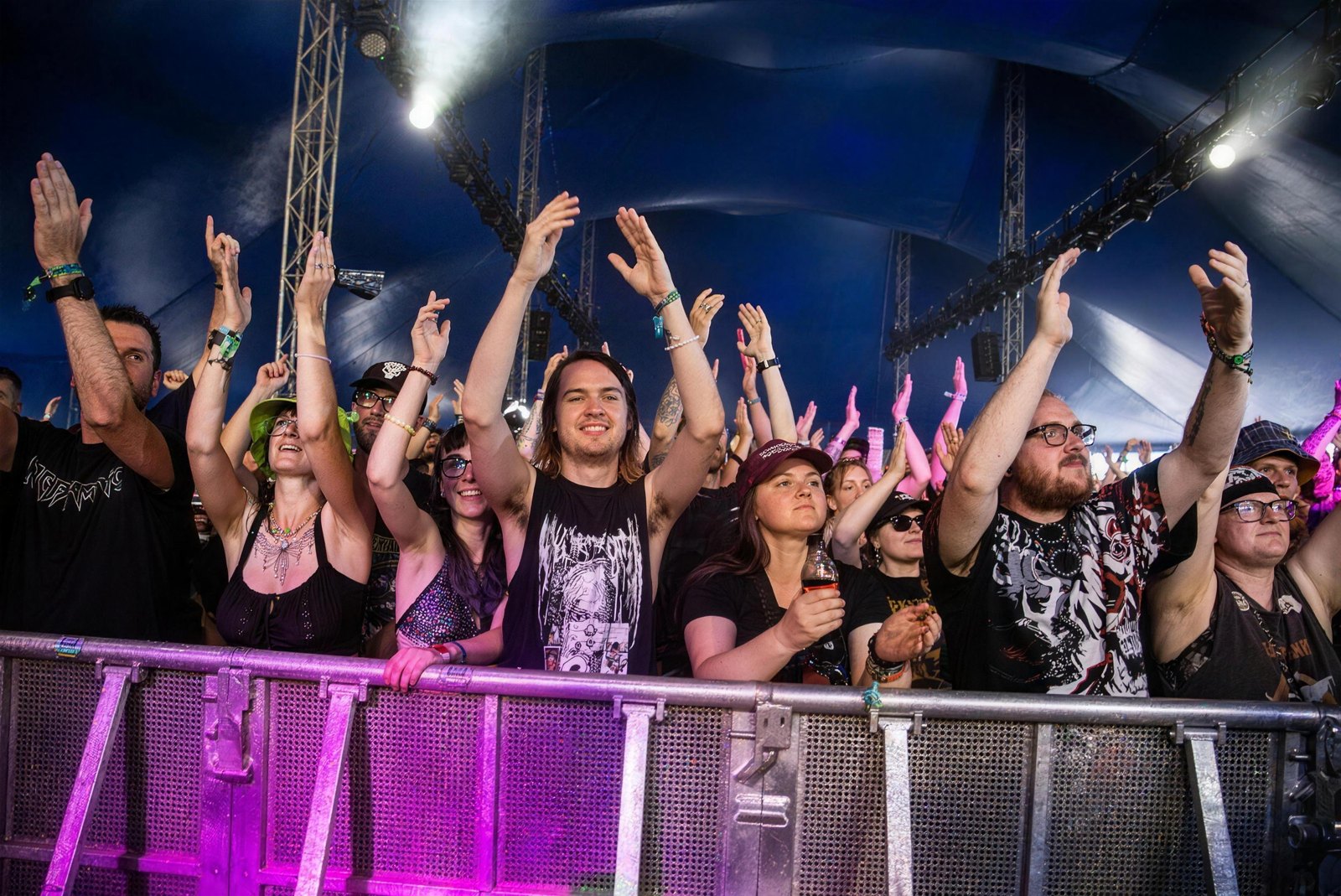 Fans in band T-shirts cheering at the barrier, Bloodstock Open Air, Catton Park, 2026