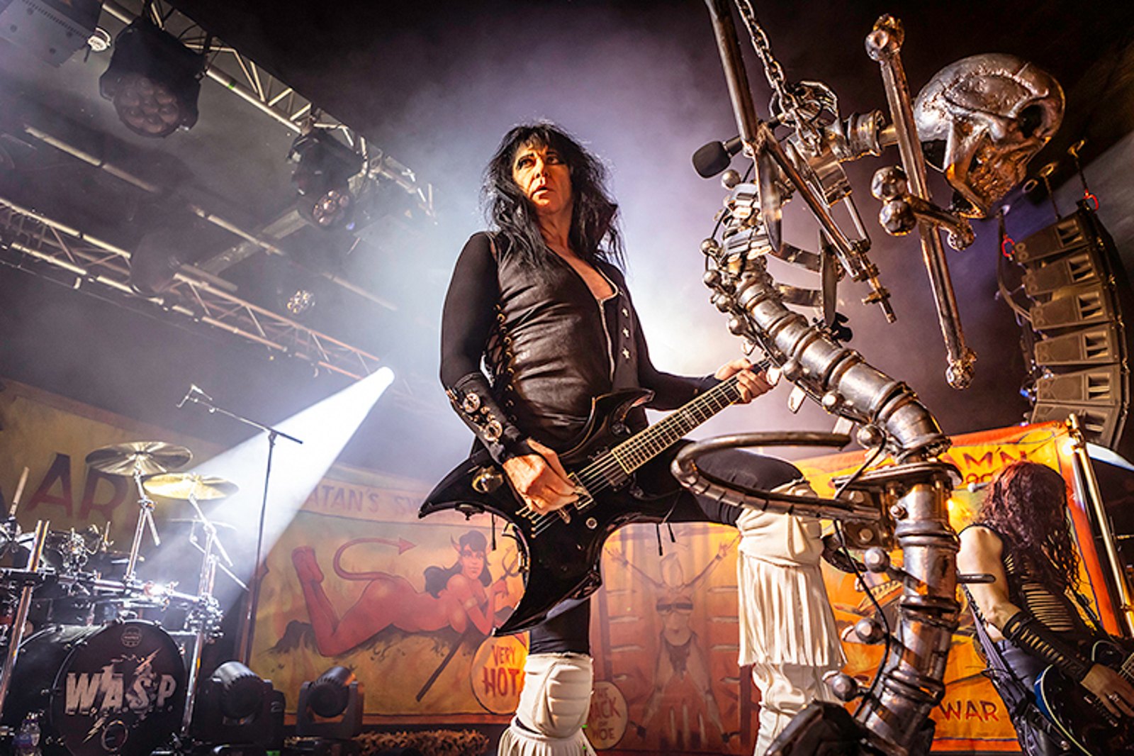 Blackie Lawless of W.A.S.P. on stage at Rock City in Nottingham in July 2025, the skull-topped microphone stand beside him
