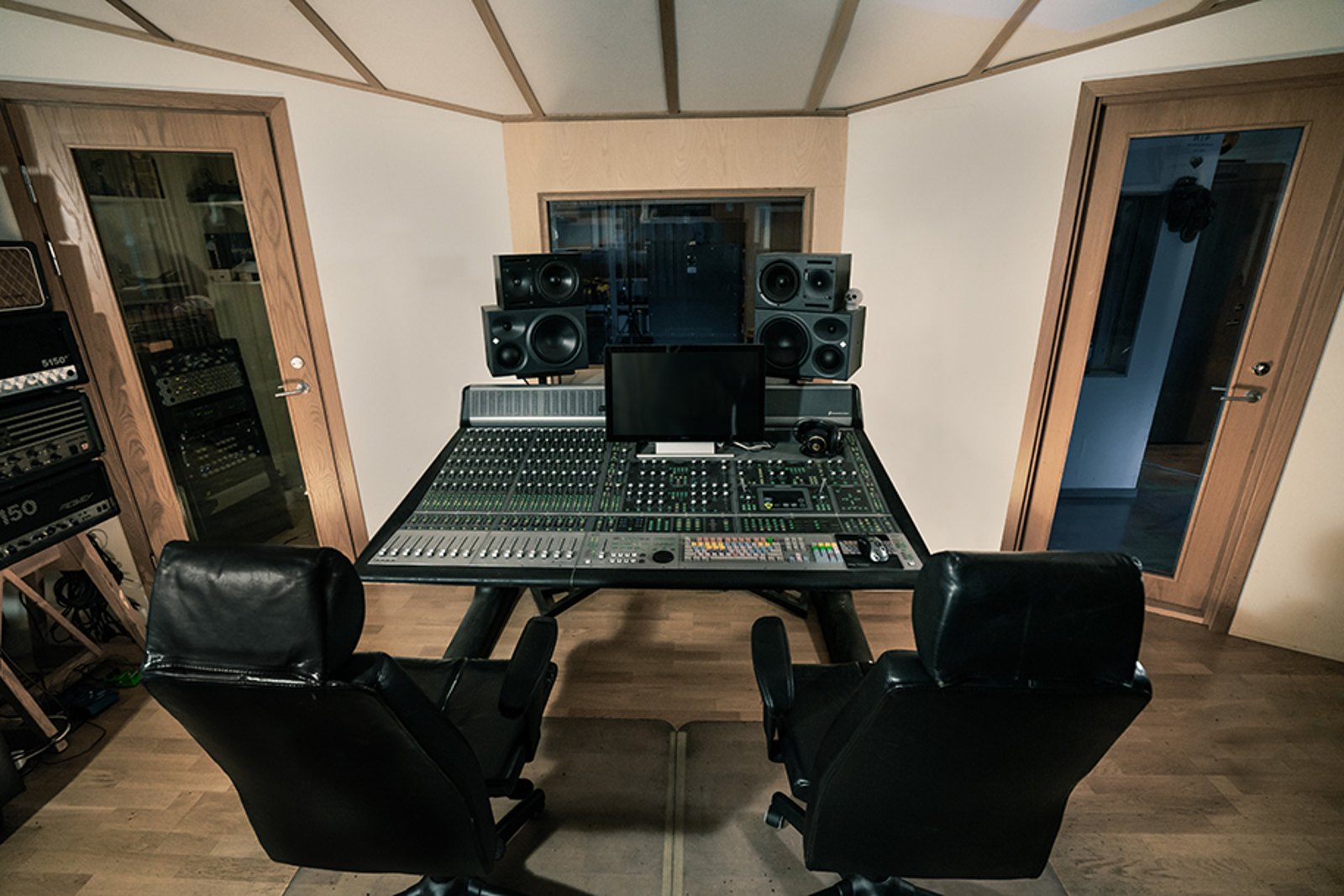 The empty control room at Studio Fredman in Gothenburg, the desk and monitors facing the glass