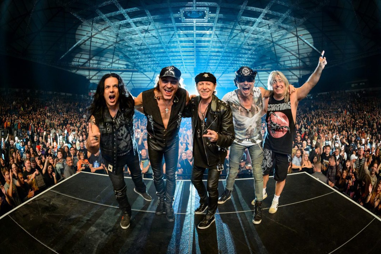 Scorpions performing on stage in front of a packed arena crowd, Seattle, 2017