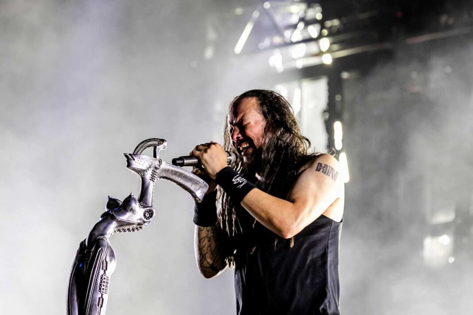 Jonathan Davis of Korn singing into his sculpted microphone stand at Gunnersbury Park, August 2024