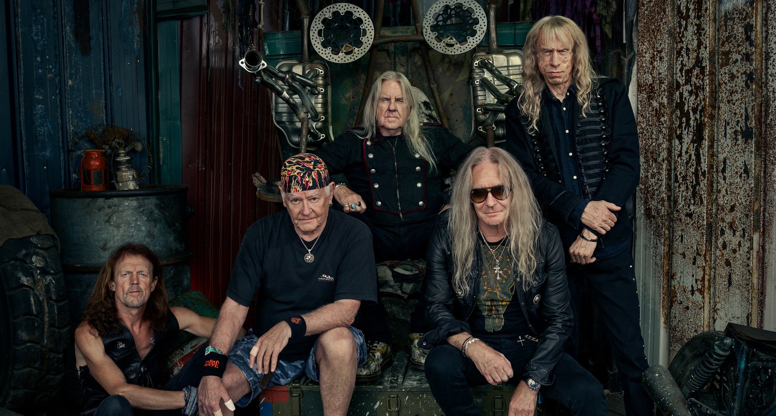 Saxon posing as a five-piece in 2026: Biff Byford, Nigel Glockler, Doug Scarratt, Nibbs Carter and Brian Tatler