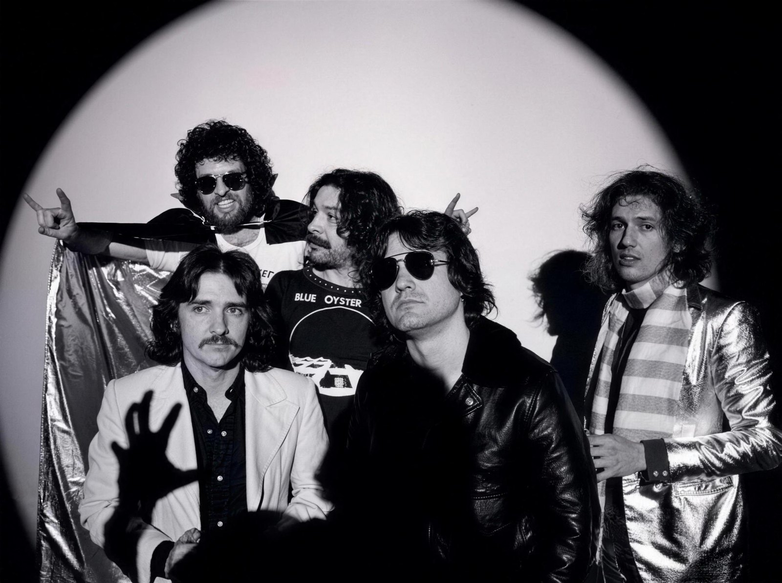 Blue Oyster Cult posed in a black and white studio portrait during the 1970s