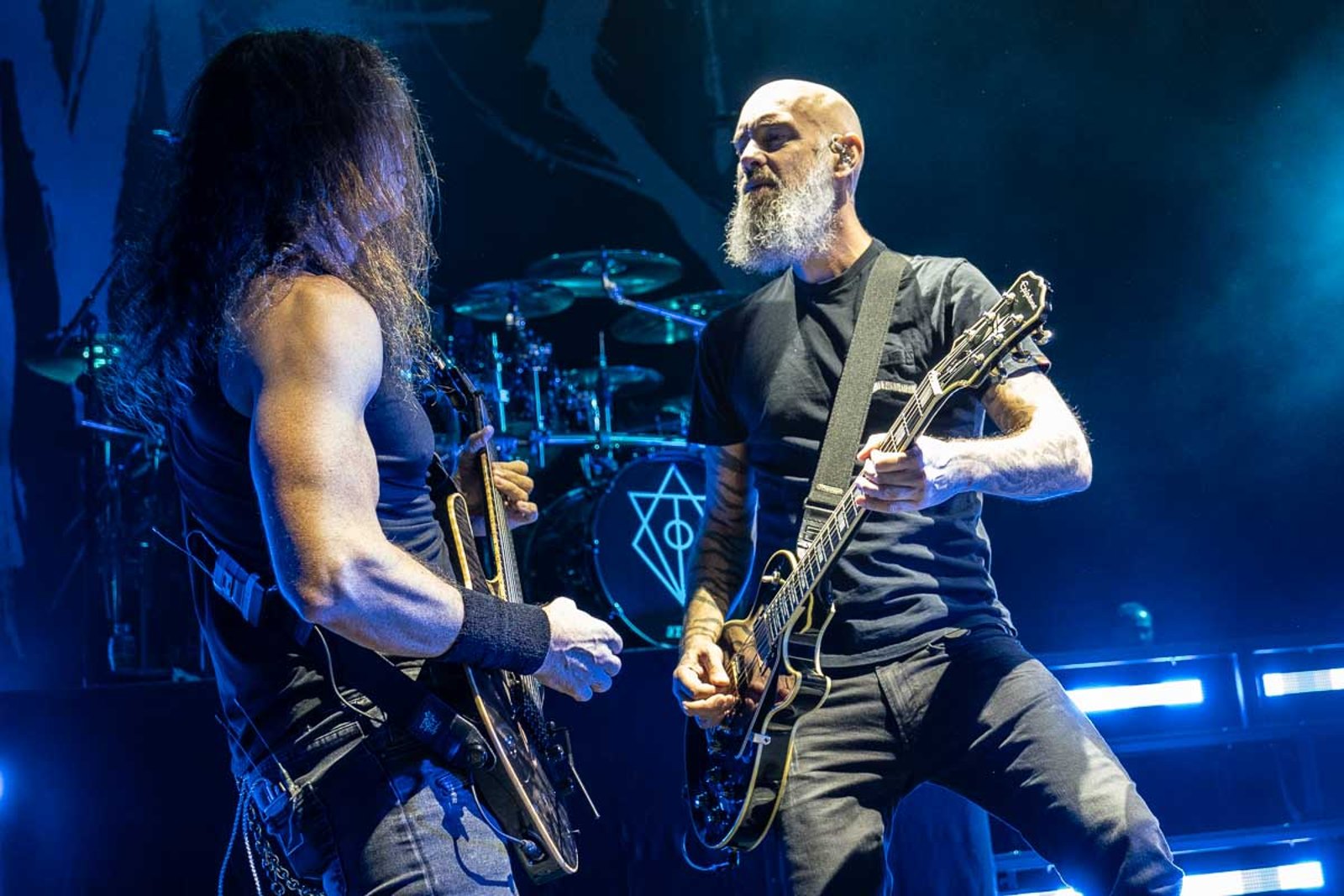 Two guitarists of In Flames playing a line together on stage in London in October 2024