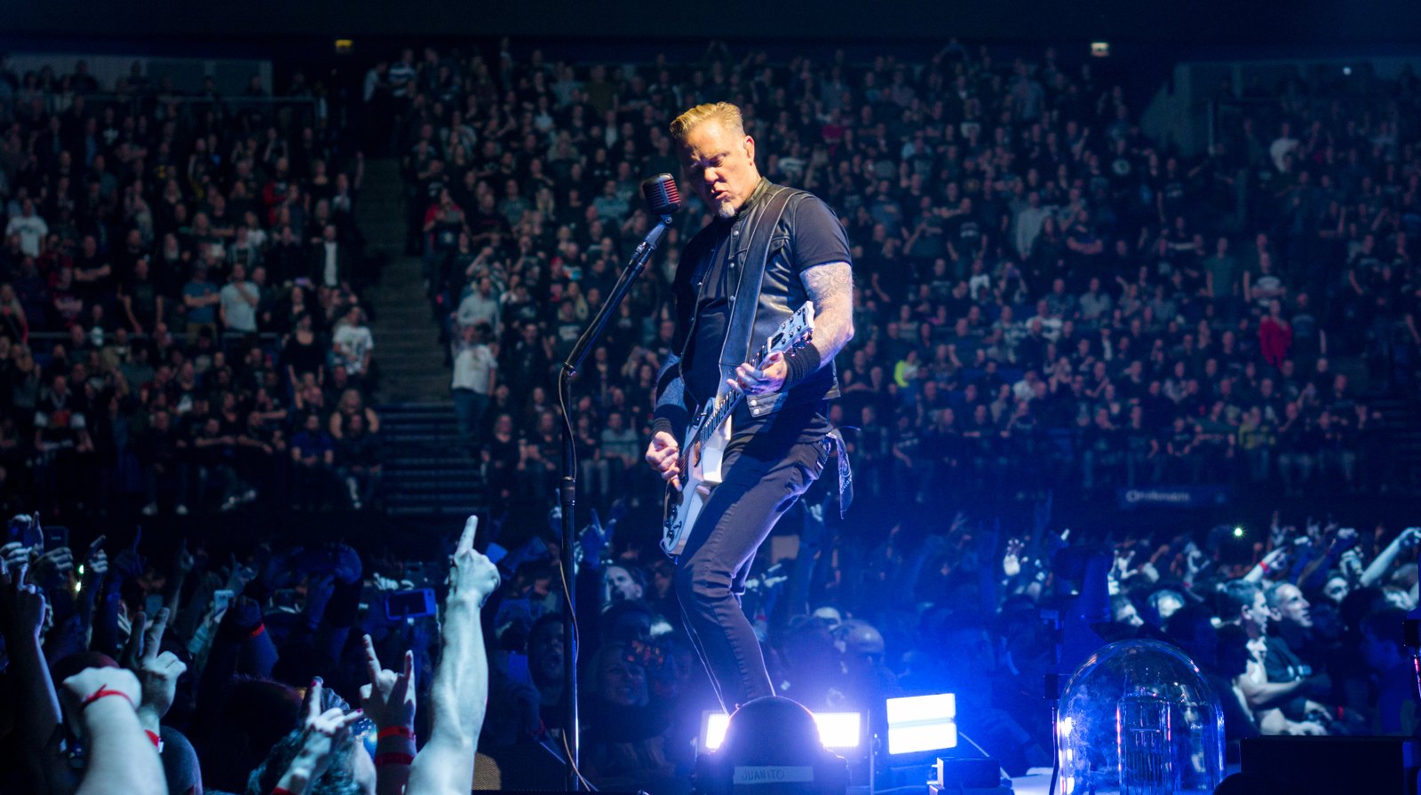 James Hetfield mid downstroke at the O2 in London in October 2017, his picking hand at the bridge