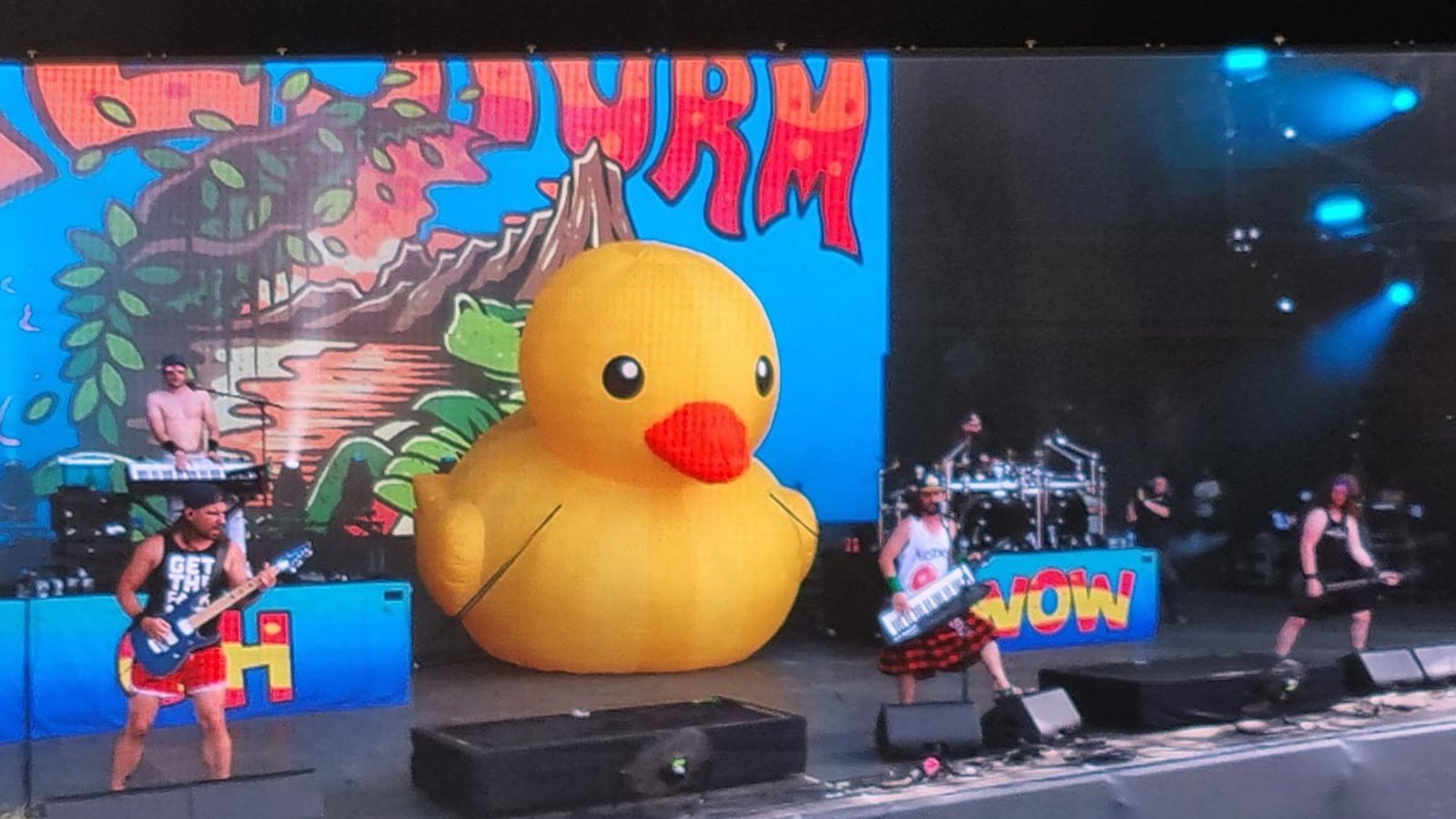 Alestorm performing on the main stage at Hellfest 2022, with their inflatable duck and a pirate-ship backdrop