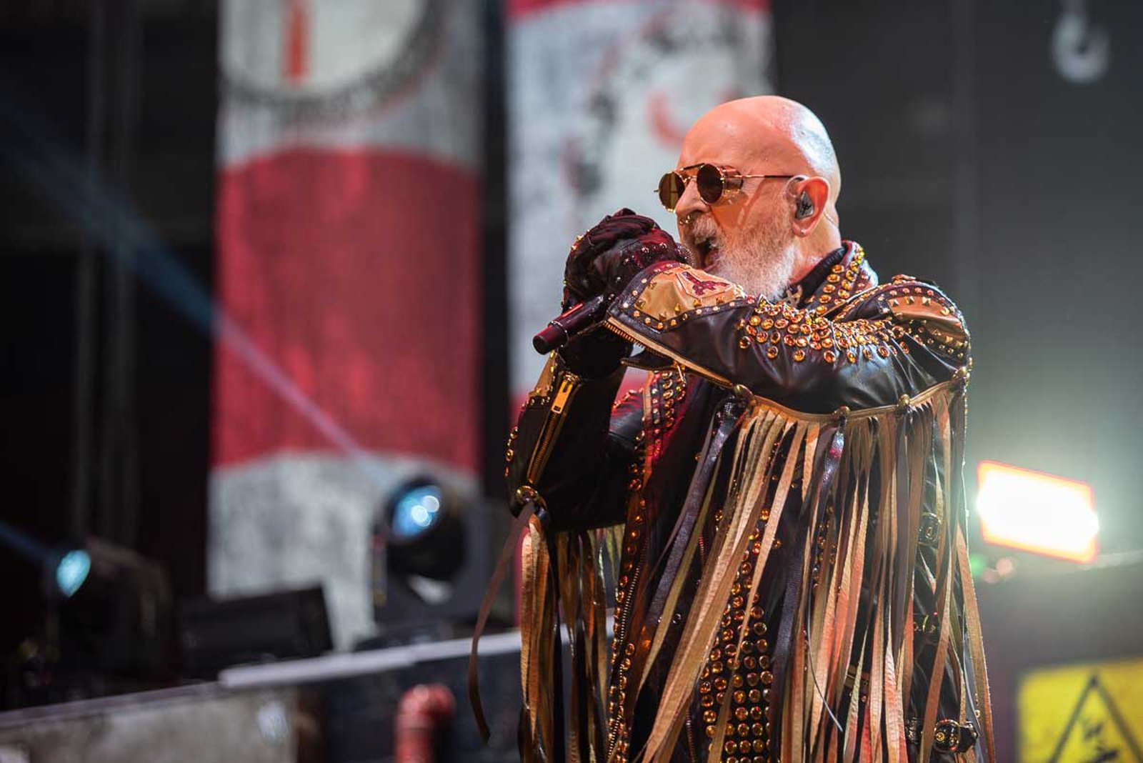 Rob Halford sings into the microphone mid-performance with Judas Priest in Newark, New Jersey, March 30, 2022