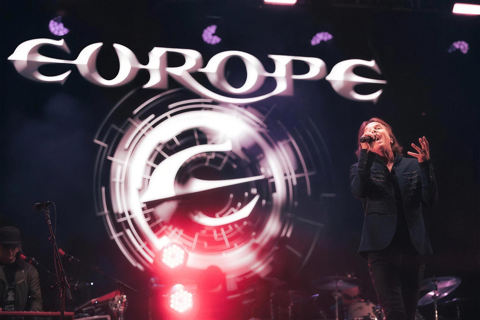 Joey Tempest of Europe singing beneath the band's logo on stage at Stonedead Festival, Newark Showground, 29 August 2026.