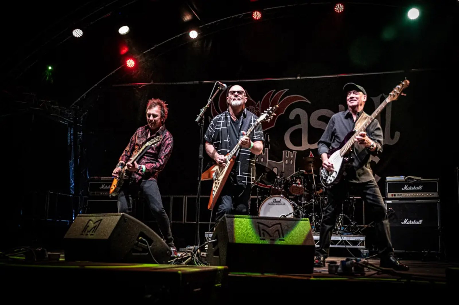 Wishbone Ash on stage at Chepstow Castle in August 2026, two guitarists side by side