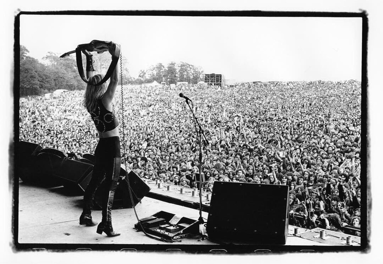 Judas Priest silhouetted before the crowd at the Monsters of Rock festival, Donington Park, 16 August 1980