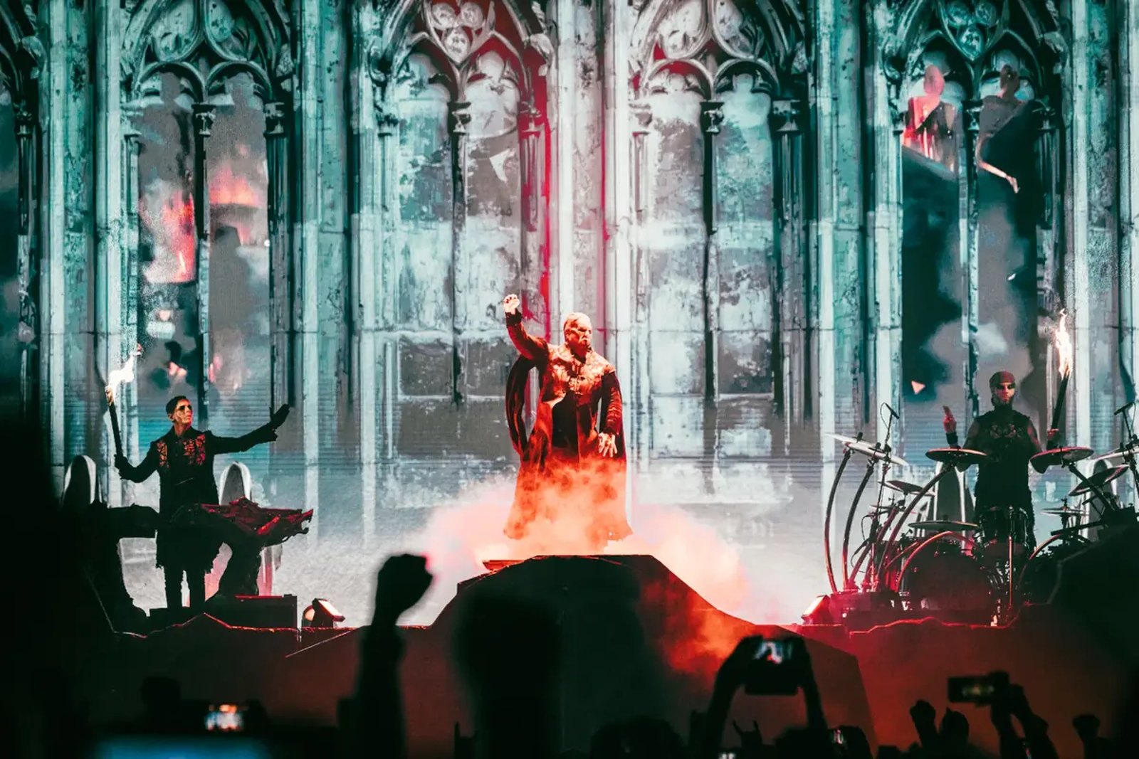 Powerwolf singer Attila Dorn on a cathedral-themed stage riser amid fire and smoke at OVO Arena Wembley, March 2026